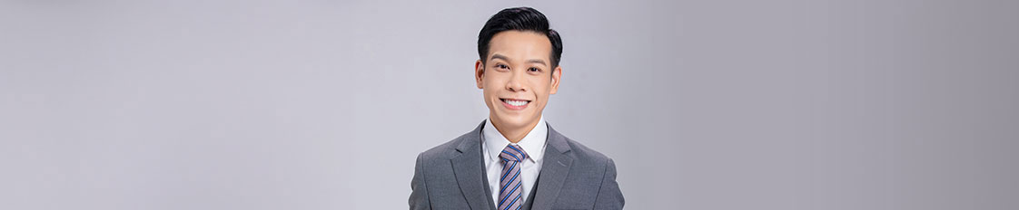 Houston Vietnamese attorney, David Nguyen, wearing a suit and tie, posing for a photo - Law Office of David Nguyen, PC.